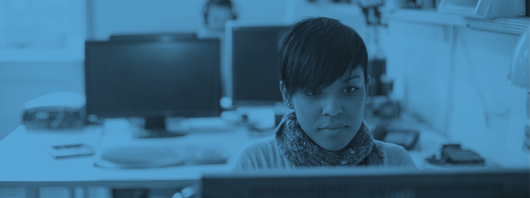 Education banner - image of woman working at computer